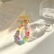 green-jelly-pink-bead-bracelet-small-yellow-fabric-piece